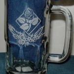 Rose etched in a glass beer mug.