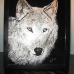 A animal etching or engraving of a wolf in glass.