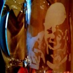 A baby picture etched in a stein.