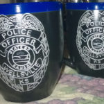 Engraved cermaic cop mugs.