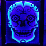 tribal skull sandcarving in led stand.